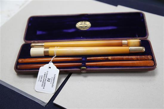An Edwardian F. Edwards & Co of Glasshouse Street leather cased set of two gold banded meerschaum cigar 10.25in.